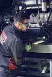 Man repairing trucks