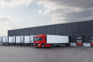 Model Year 2025: Renault Trucks T fitted with rear-view cameras (CMS: Camera Monitoring System, replacing wing mirrors) at a loading bay in a logistics warehouse