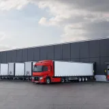 Model Year 2025: Renault Trucks T fitted with rear-view cameras (CMS: Camera Monitoring System, replacing wing mirrors) at a loading bay in a logistics warehouse