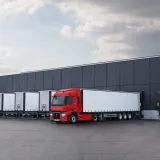 Model Year 2025: Renault Trucks T fitted with rear-view cameras (CMS: Camera Monitoring System, replacing wing mirrors) at a loading bay in a logistics warehouse