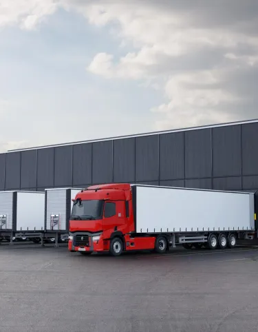 Model Year 2025: Renault Trucks T fitted with rear-view cameras (CMS: Camera Monitoring System, replacing wing mirrors) at a loading bay in a logistics warehouse